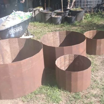 Rustic round steel planters